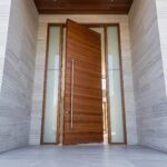 Luxury wooden Pivot Door Double Heighted Door with horizontal detailing and glass sidelights by Tarkhan Door
