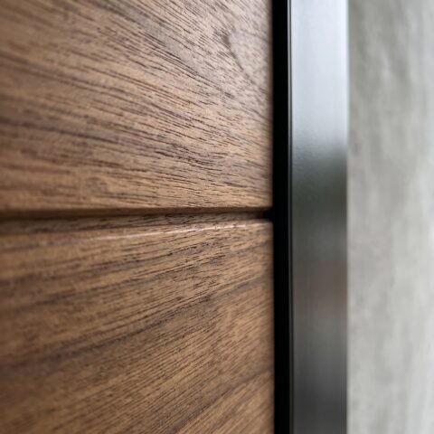 Tarkhan Door Double Heighted Door with natural wood finish, horizontal detailing and full-height glass sidelights
