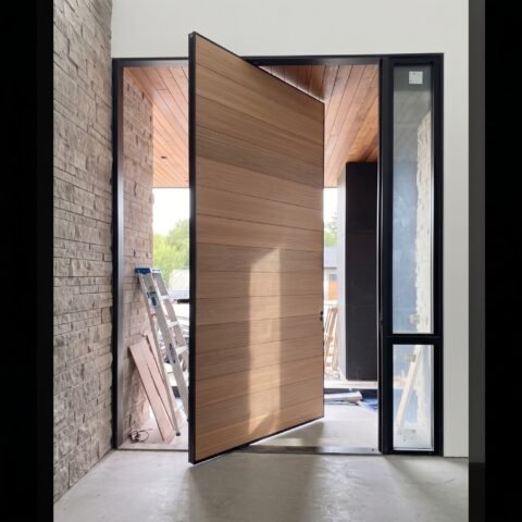 Tarkhan Door Double Heighted Door with natural wood finish, horizontal detailing and full-height glass sidelights