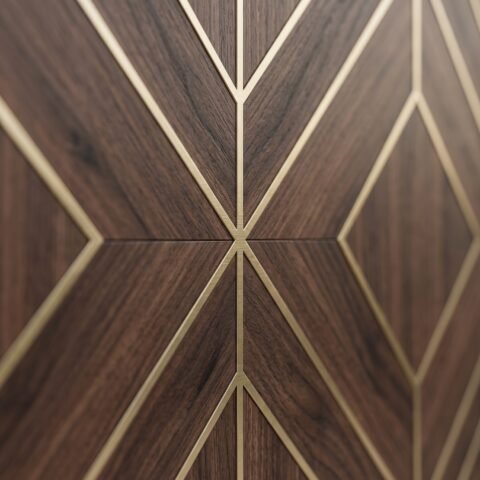 Tarkhan Door Double Hieghted Door with dark wood finish, geometric gold inlay and glass sidelights at a luxury entrance