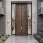 Tarkhan Door Double Hieghted Door with dark wood finish, geometric gold inlay and glass sidelights at a luxury entrance
